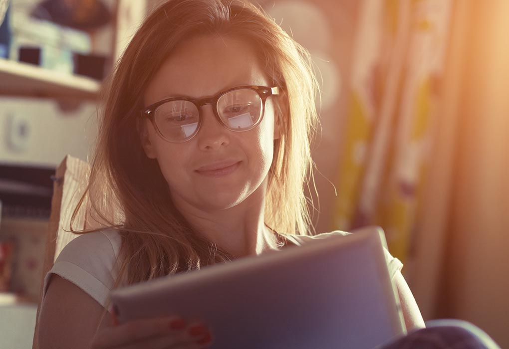 Woman using a tablet while working from home