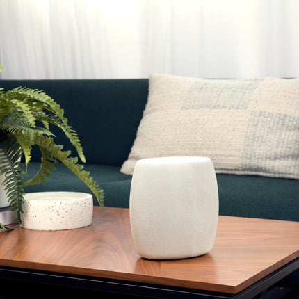 Side view of a Motorola Q14 mesh router/extender device on a living room coffee table